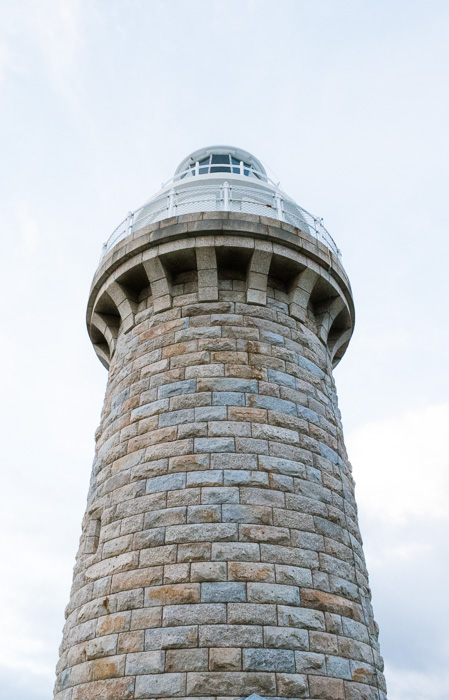 Wilsons Promontory Lighthouse during the day in Portrait photo with cloudy skies